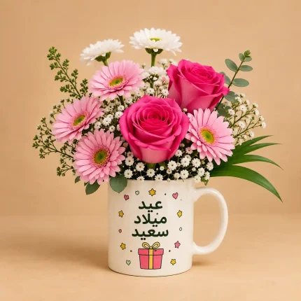 Birthday mug with mixed pink flowers including roses, gerbera daisies, white chrysanthemums, baby's breath and eucalyptus