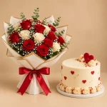 Red and white roses with baby's breath and gold-touched eucalyptus paired with a vanilla heart cake
