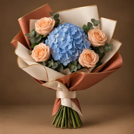 Blue hydrangea with four peach roses and eucalyptus in ivory and terracotta wrapping