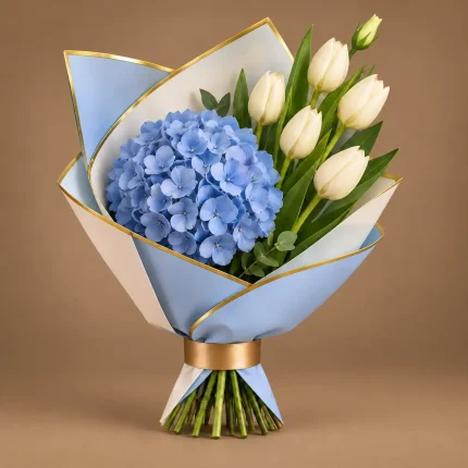Blue hydrangea and white tulip bouquet with fresh greenery