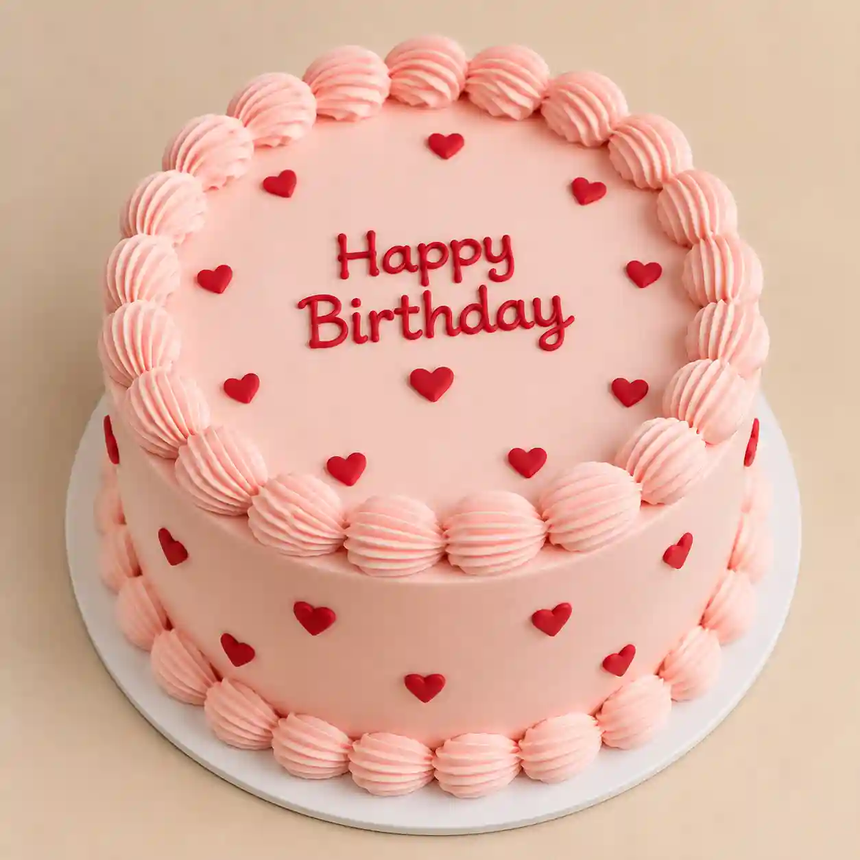 Classic Heart Cake with Piped Message Pink or ivory heart-shaped buttercream cake with red fondant hearts, piped shell borders and red-script message