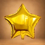 Metallic gold star-shaped foil balloon for birthdays and celebrations