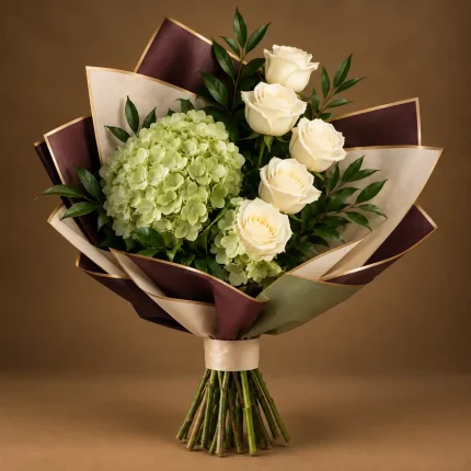 Two green hydrangeas with ivory roses and fresh greenery in sage, maroon and beige wrapping