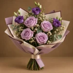 Lavender roses and deep purple lisianthus with white filler flowers and eucalyptus