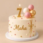 Personalised birthday cake with gold-script name, matching age candle and ivory or pink decorative design