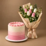 Pink ombre birthday cake with pink and white tulip bouquet
