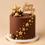 Tall star birthday cake with gold sugar stars, decorative spheres and gold Happy Birthday topper